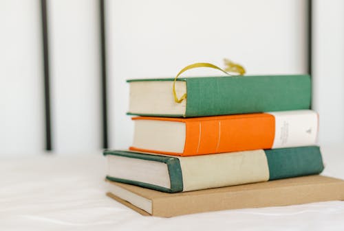 Close-Up Photo of Stack of Hardbound Books