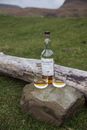 Bottle of whiskey with glass cups