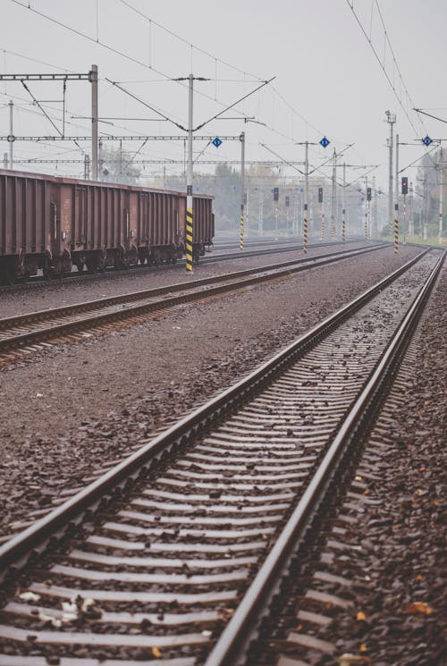 Railway against overcast sky on street