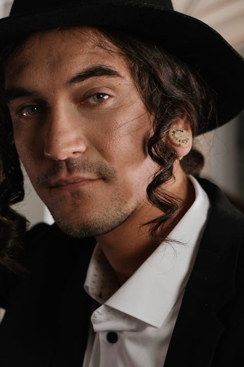 Photo of an Elegant Man Wearing a White Shirt and Fedora Hat 