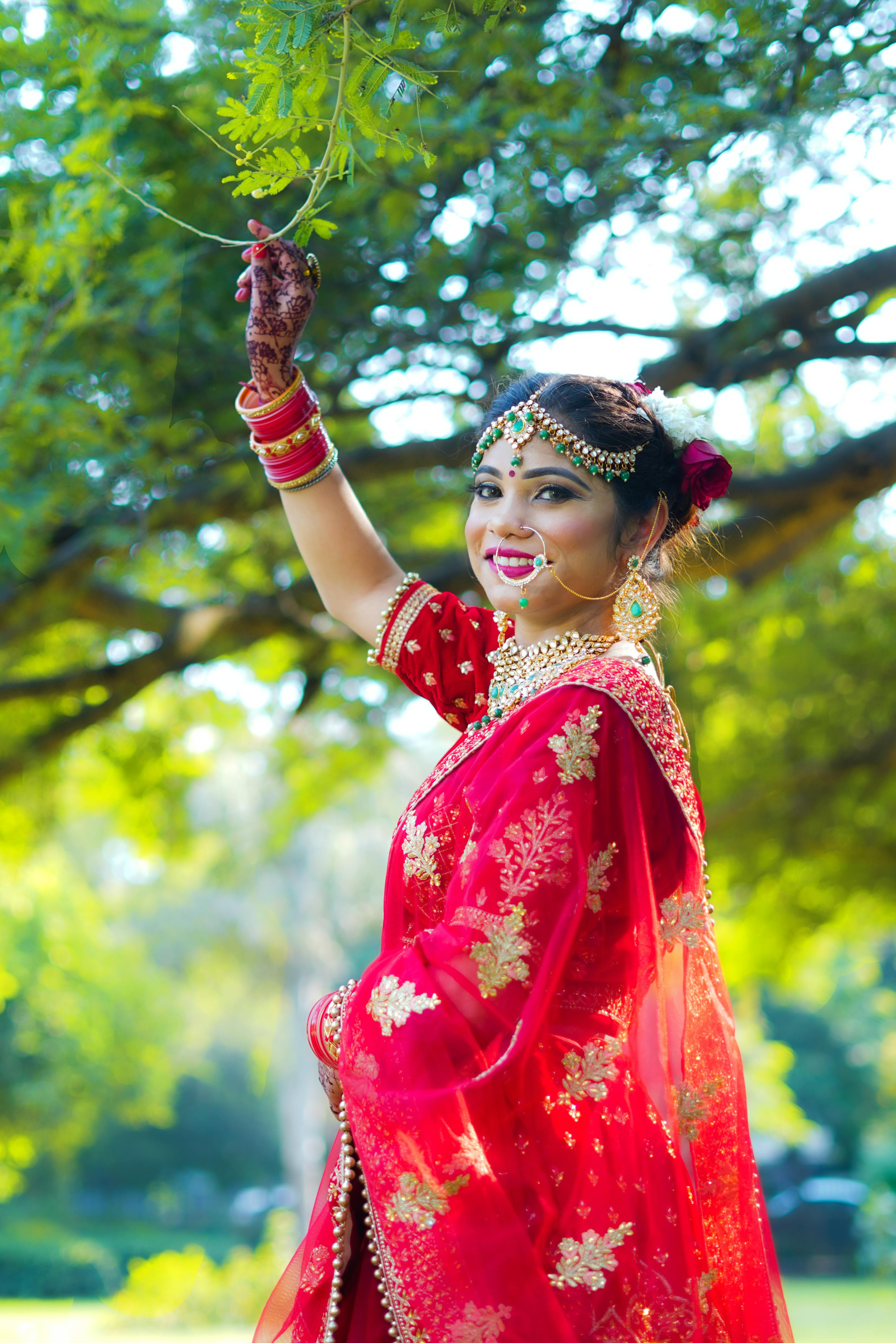 A Hindu Bride Wearing a Traditional Outfit and Henna Tattoos · Free Stock  Photo