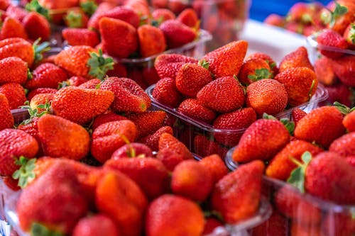Heap of strawberries in containers