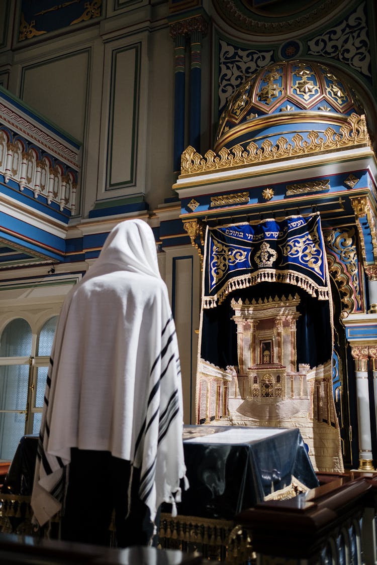 A Person Inside A Church Praying