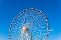 White and Red Ferris Wheel Under Blue Sky