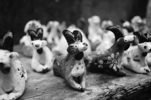Free A close-up of handmade clay animal figurines in grayscale, highlighting artistic craftsmanship. Stock Photo