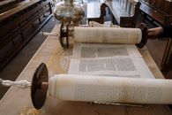 White Book Page on Brown Wooden Table