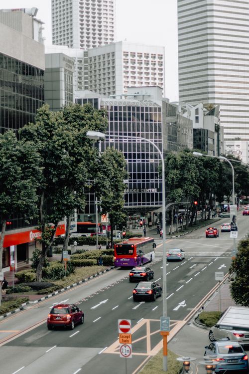 Free A vibrant street scene in Singapore showcasing traffic and modern architecture. Stock Photo