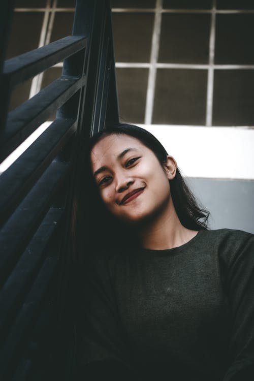 Woman Leaning on a Railing