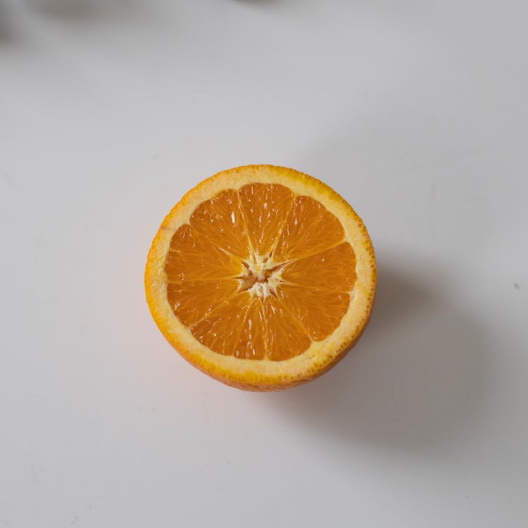 Half Of Orange On Table