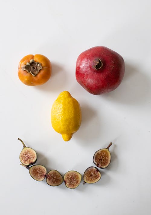 Fresh ripe fruits composed in face on table