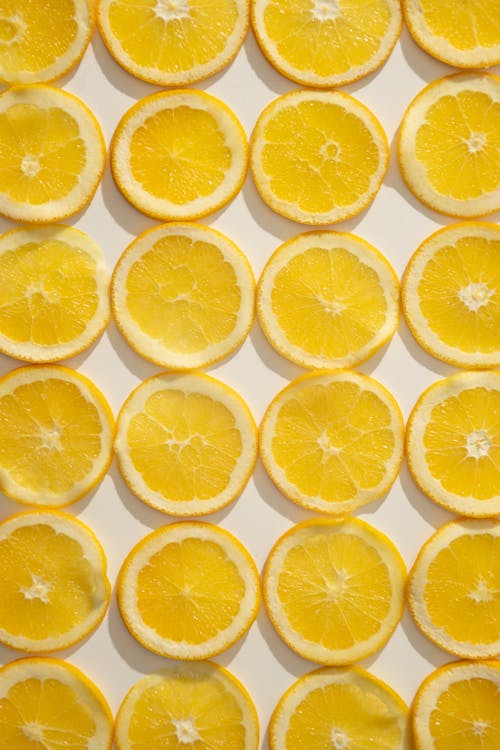 Sliced citrus fruits laid on table