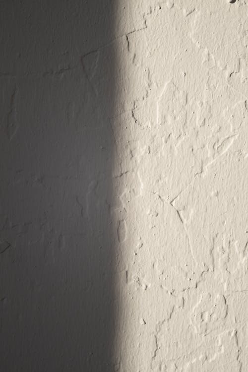 Rough concrete wall of white color
