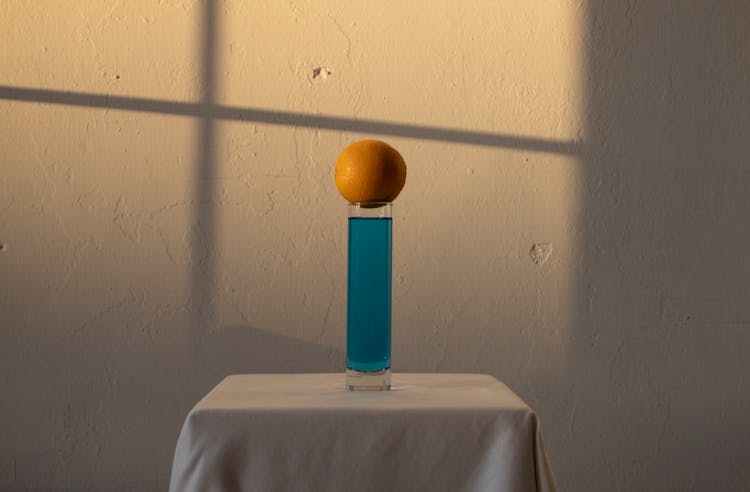 Long Glass With Blue Drink And Orange Above