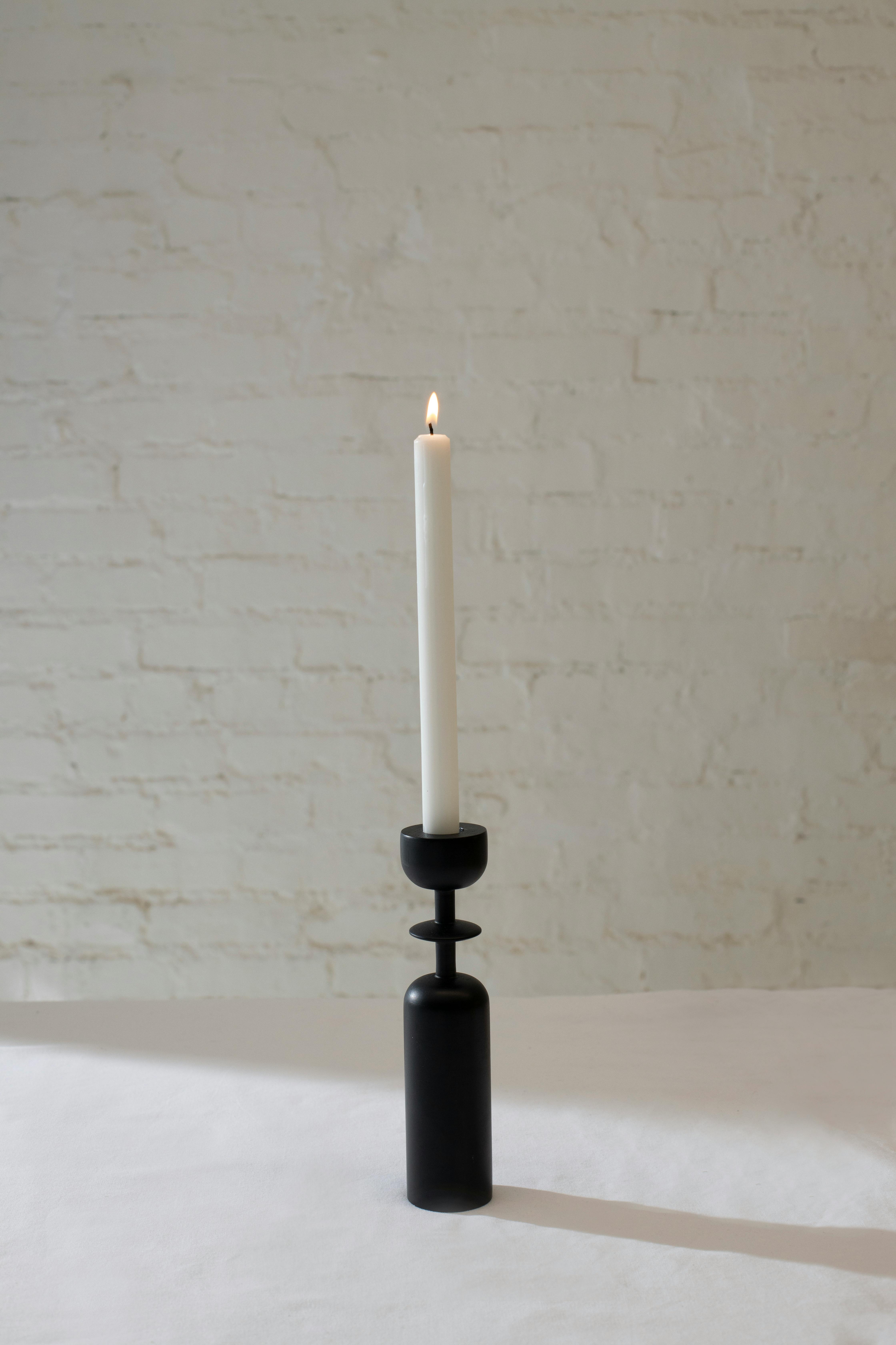 candle placed on white table