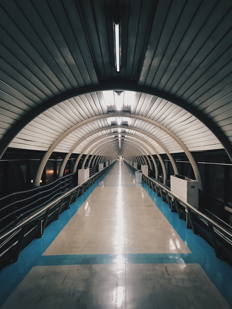 Tunnel With White And Blue Flooring