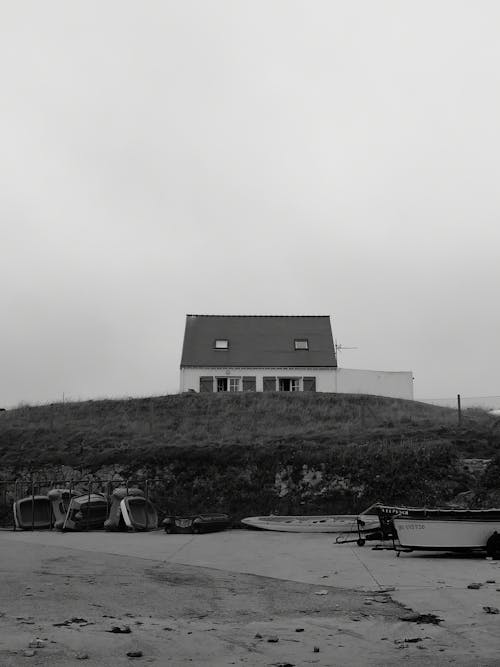 Free Grayscale Photo of a House near the Beach Stock Photo