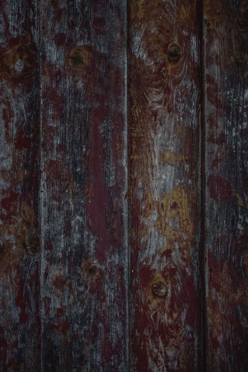 Free Close-up of a rustic wooden plank wall with aged, weathered texture and rich brown tones, ideal for backgrounds. Stock Photo