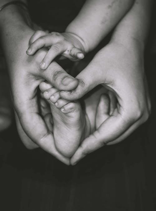 Free Holding the Feet of a Baby Stock Photo
