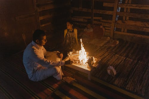 A Man and a Woman Cooking at the Table