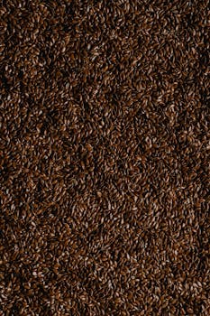Close-up shot of brown flaxseeds, ideal for food photography and texture backgrounds.