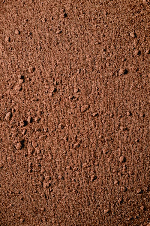 бесплатная Коричневый песок с каплями воды Стоковое фото