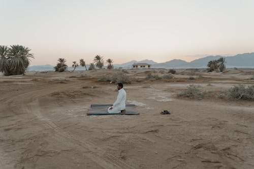 Photo Of Man Kneeling On A Mat