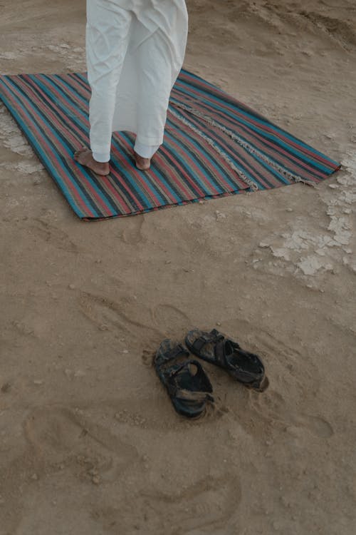 A Person Standing on a Prayer Mat