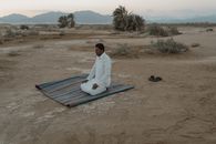 Photo Of Man Kneeling On Mat
