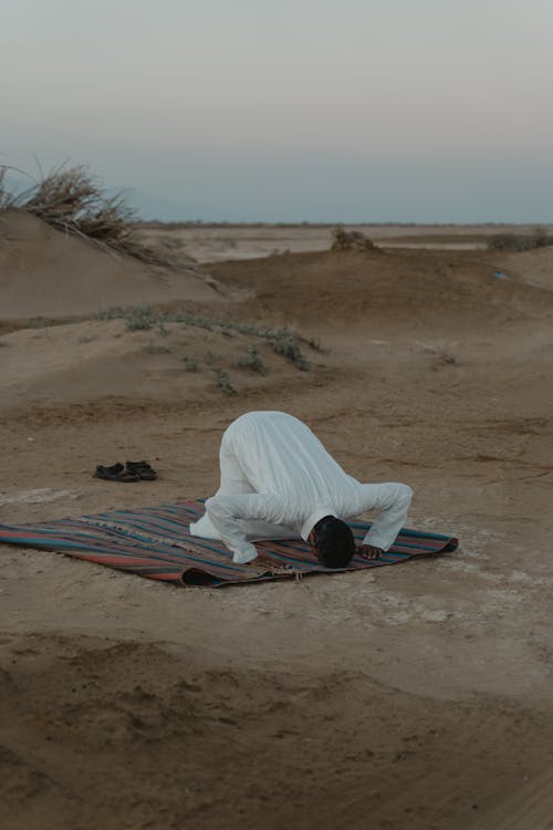 Photo Of Man Praying During Dawn 