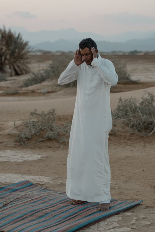 Photo Of Man Standing Wearing Traditional Clothing