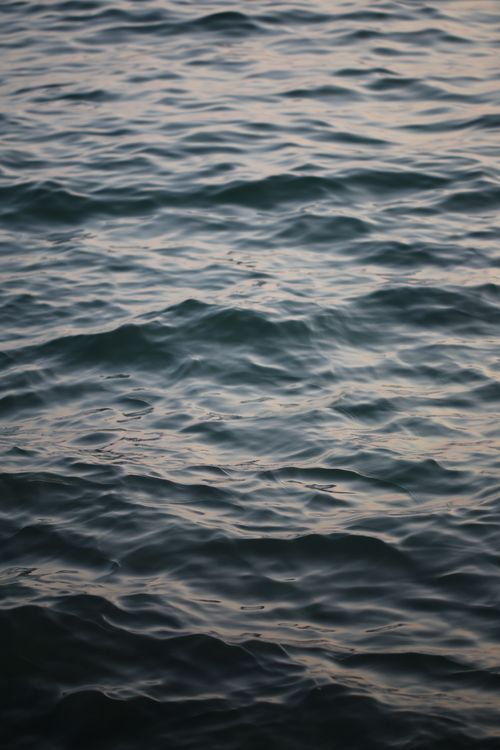 Free High angle of dark blue water with ripples on surface in twilight time Stock Photo