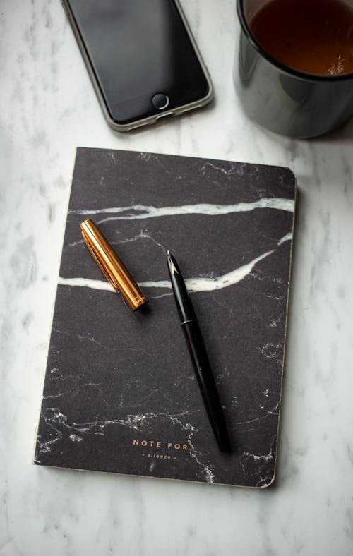 A Pen on a Notebook 