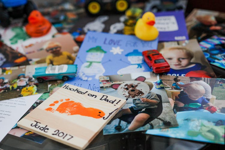 Set Of Photos And Toys On Table