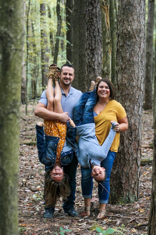 Happy family having fun in forest
