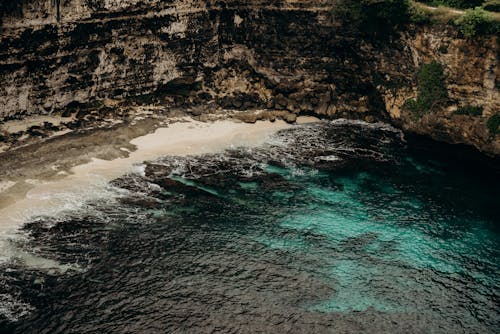 An Aerial Photography of a Rock Formation Near the Body of Water