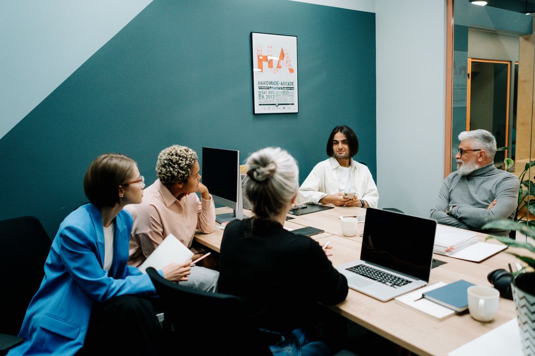 Employees taking part in a workplace discussion