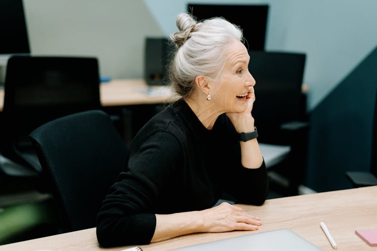 Laughing Woman At The Desk In The Office