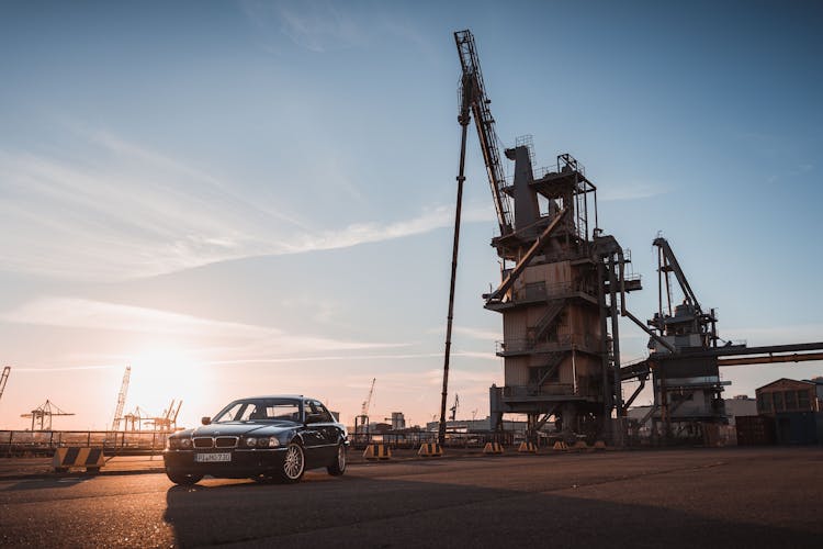 Black Car Parked Near A Crane