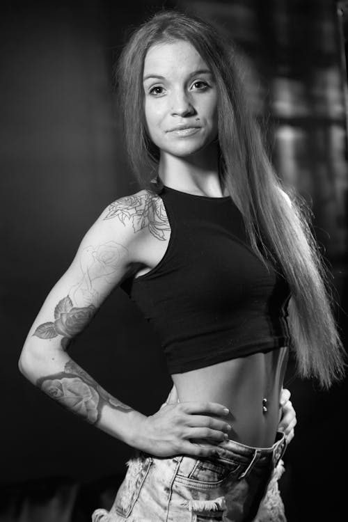 Woman in Crop Top Posing with Hands on Waist