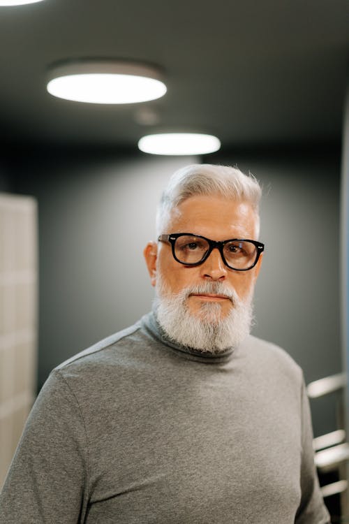 Man in Gray Shirt and Black Framed Eyeglasses