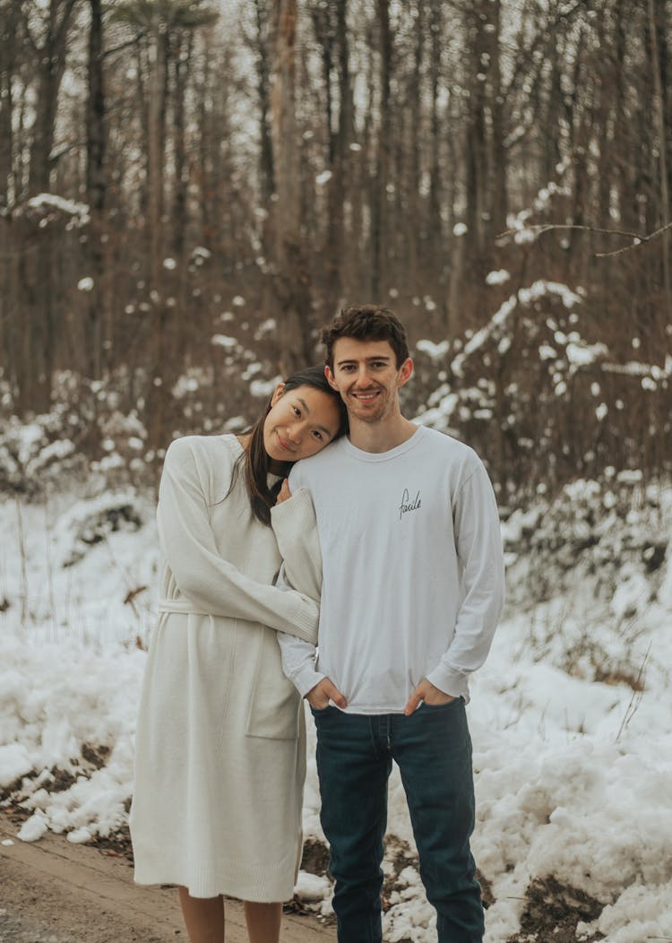 Diverse Couple In Winter Snowy Forest