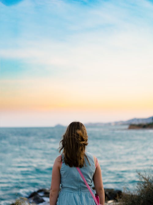 Free stock photo of back view, girl, golden hour Stock Photo