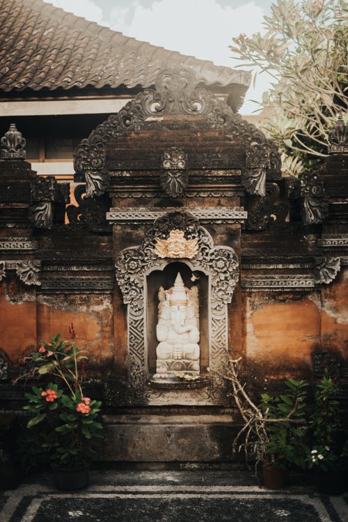 Free A beautifully detailed Ganesha shrine at a Balinese temple, showcasing traditional Hindu architecture. Stock Photo