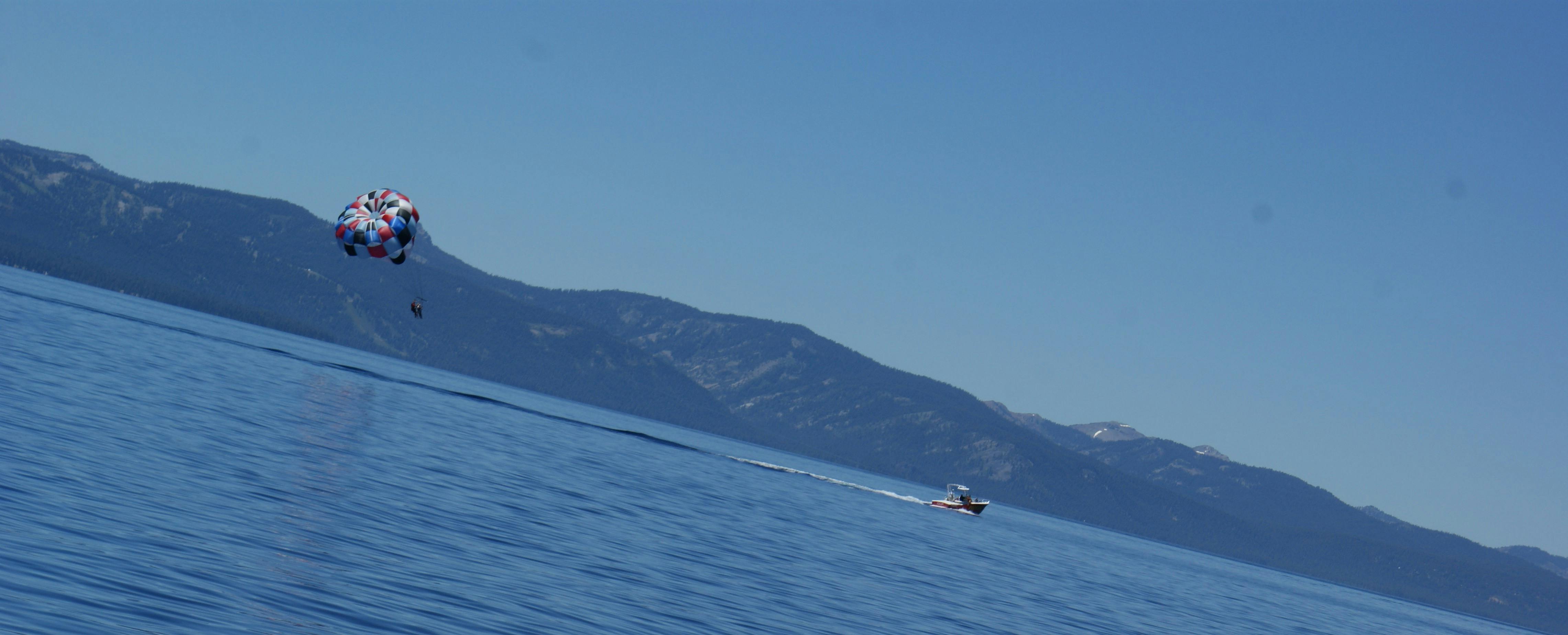 Young man in Ugandan market using smartphone