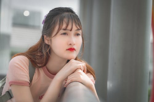 Woman Leaning on Handrail