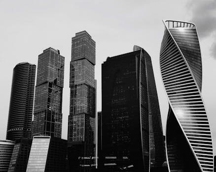 Captivating black and white image of modern high-rise buildings in a cityscape, showcasing urban architecture.