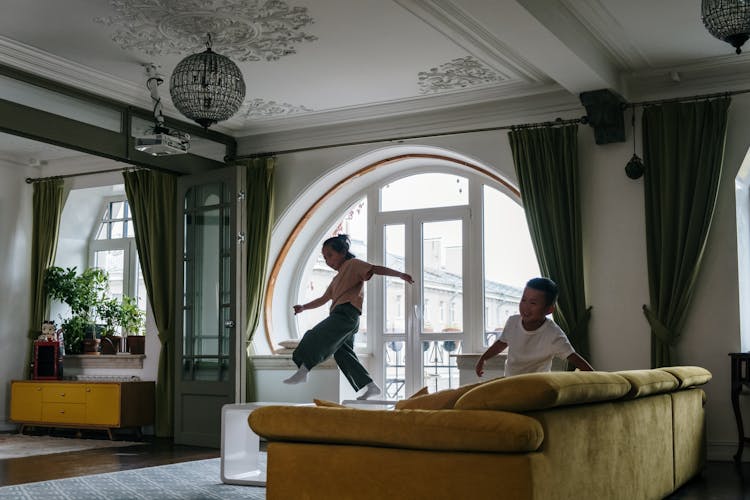 Children Playing On The Living Room