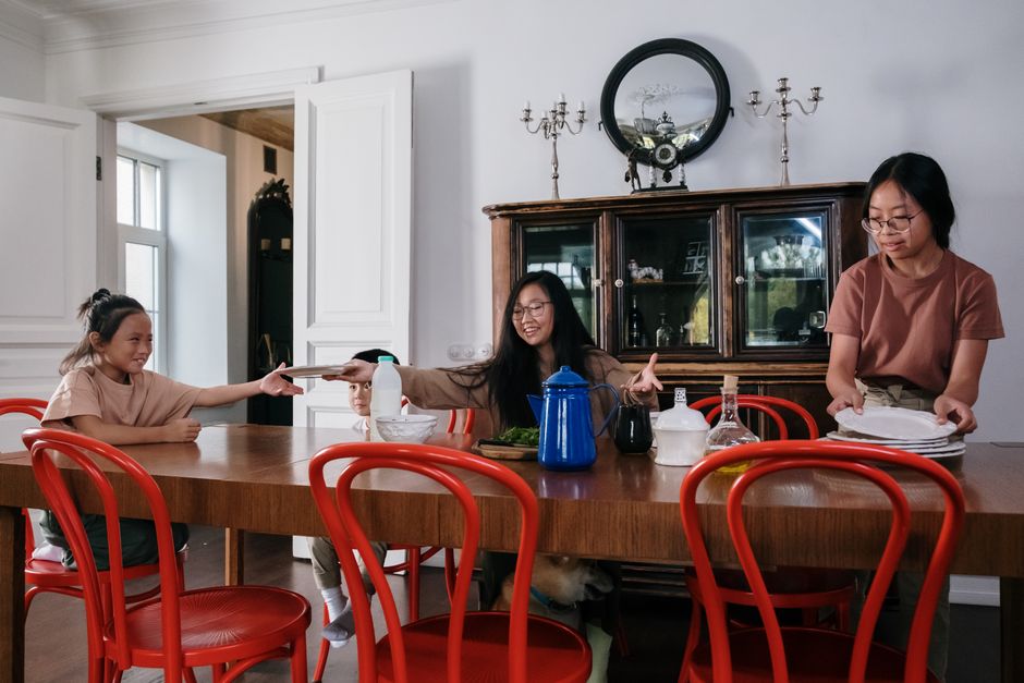 Photo by cottonbro studio on Pexels Siblings tidying up the dining table together, showcasing teamwork and family bonding. - Photo by cottonbro studio on Pexels