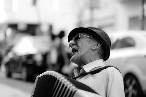 Man Singing While Playing Accordion