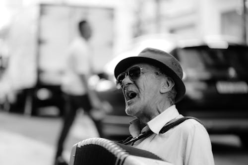 Black and White Photo of an Eldery Man Singing